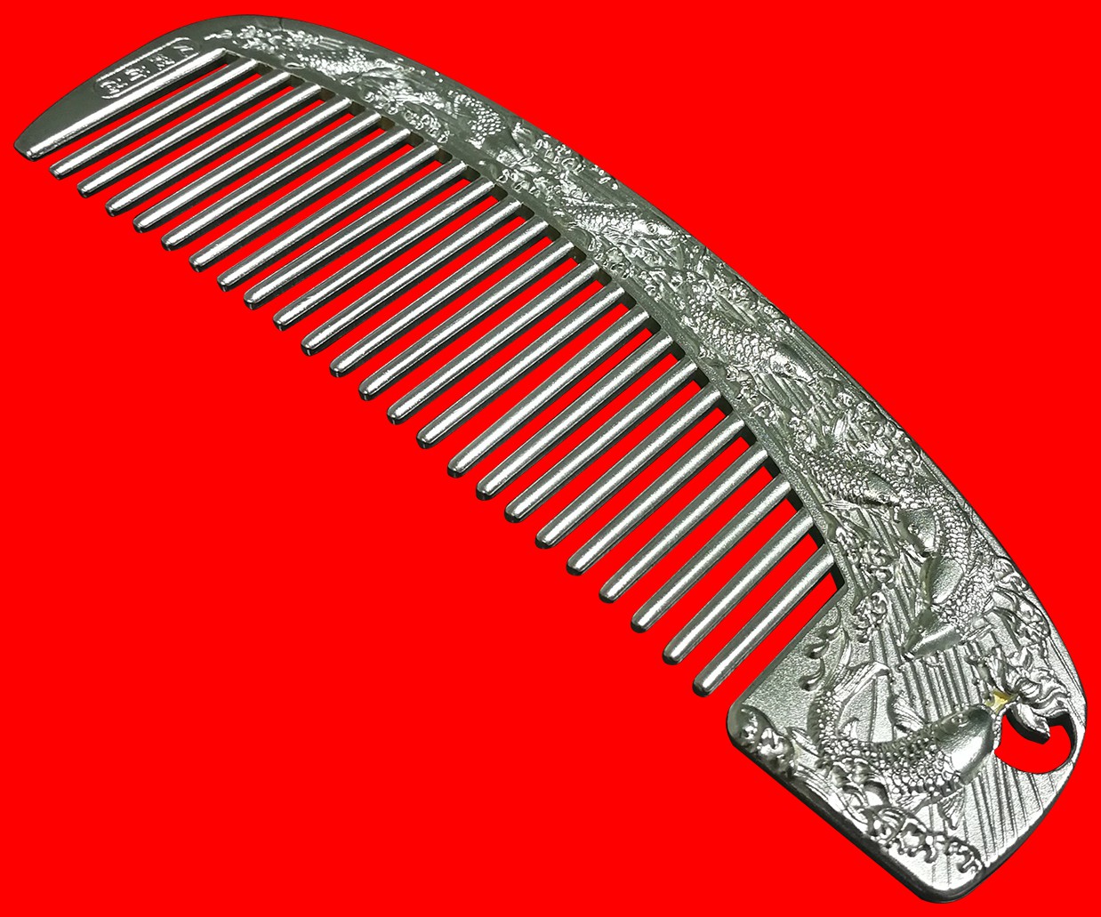 摘要附图摘要1.本外观设计产品的名称:梳子(九鲤银梳).2.